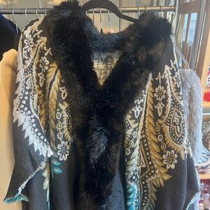 Beautiful NEW wrap.  Faux fur collar.  One size.  
Wide arm opening